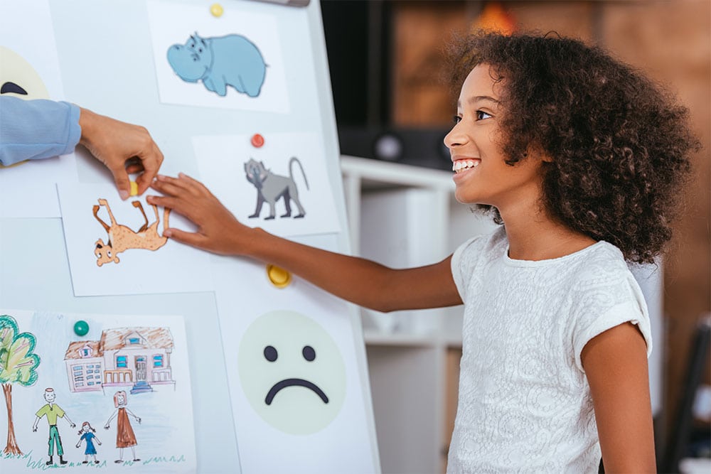 African american girl with artwork board