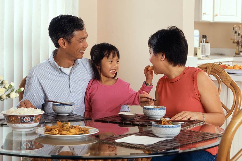 Asian family at dinner table