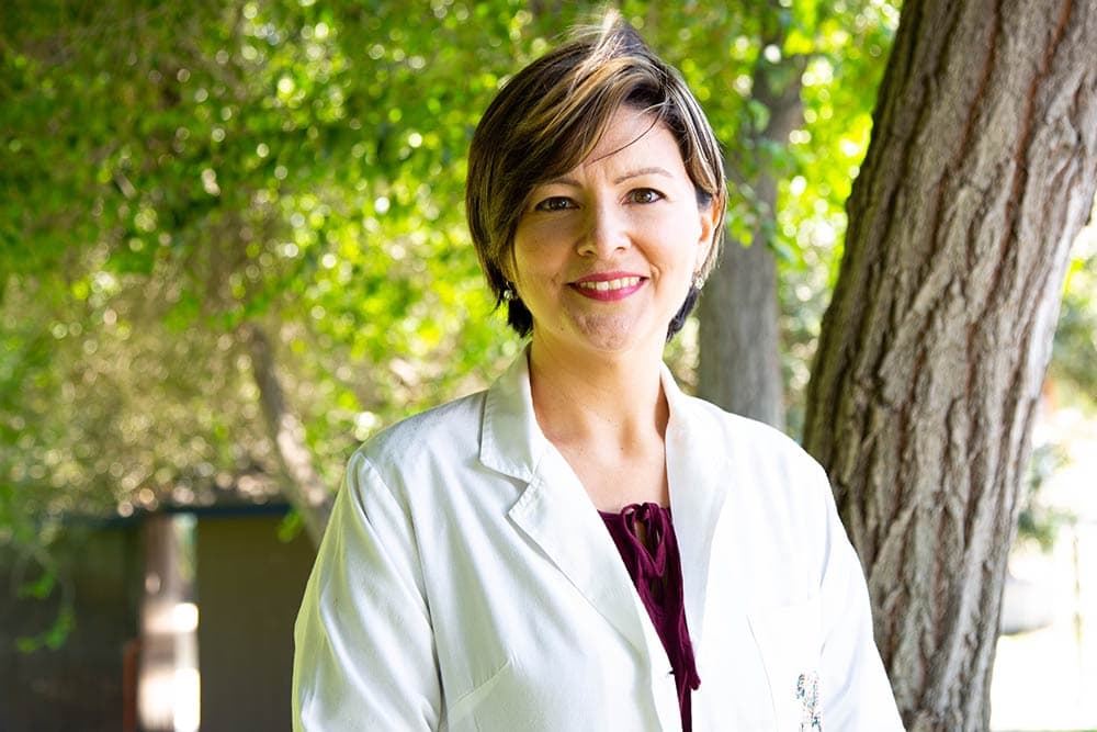 White female doctor blazer with trees